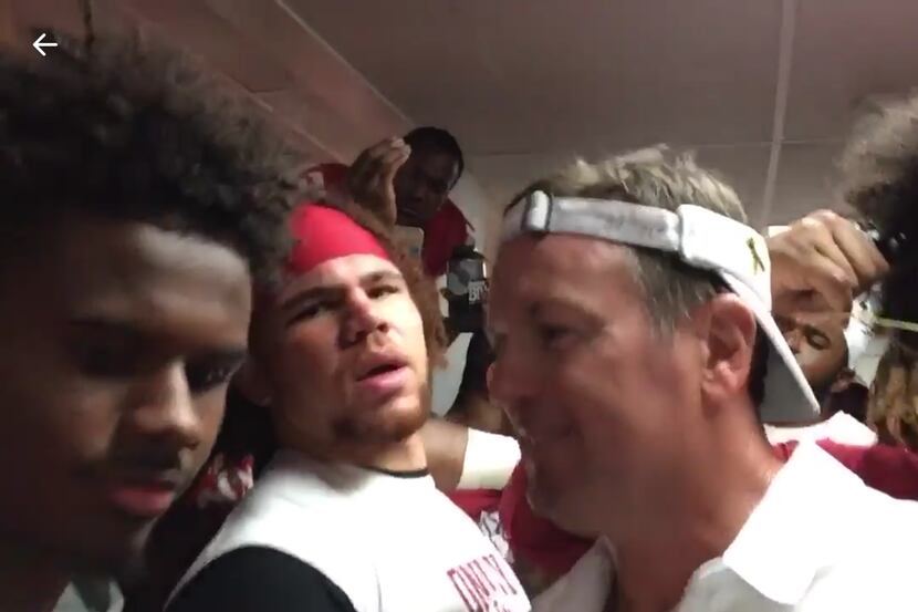 Oklahoma coach Bob Stoops participates in his team's attempt at the Mannequin Challenge...