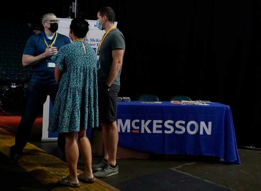 McKesson talent acquisition director Paul Parker speaks with students at HackDFW at Comerica...