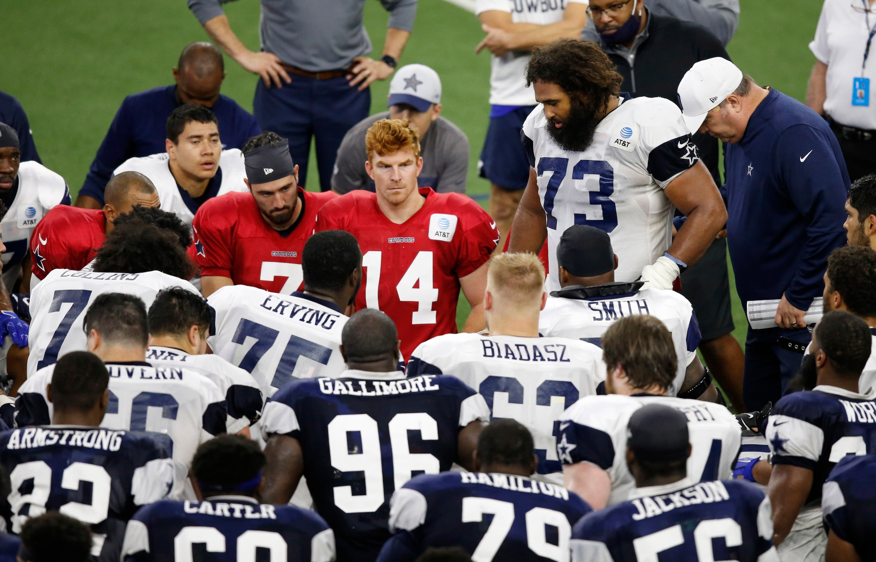 Dallas Cowboys center Joe Looney (73) talks to his teammate shortly after practice during...