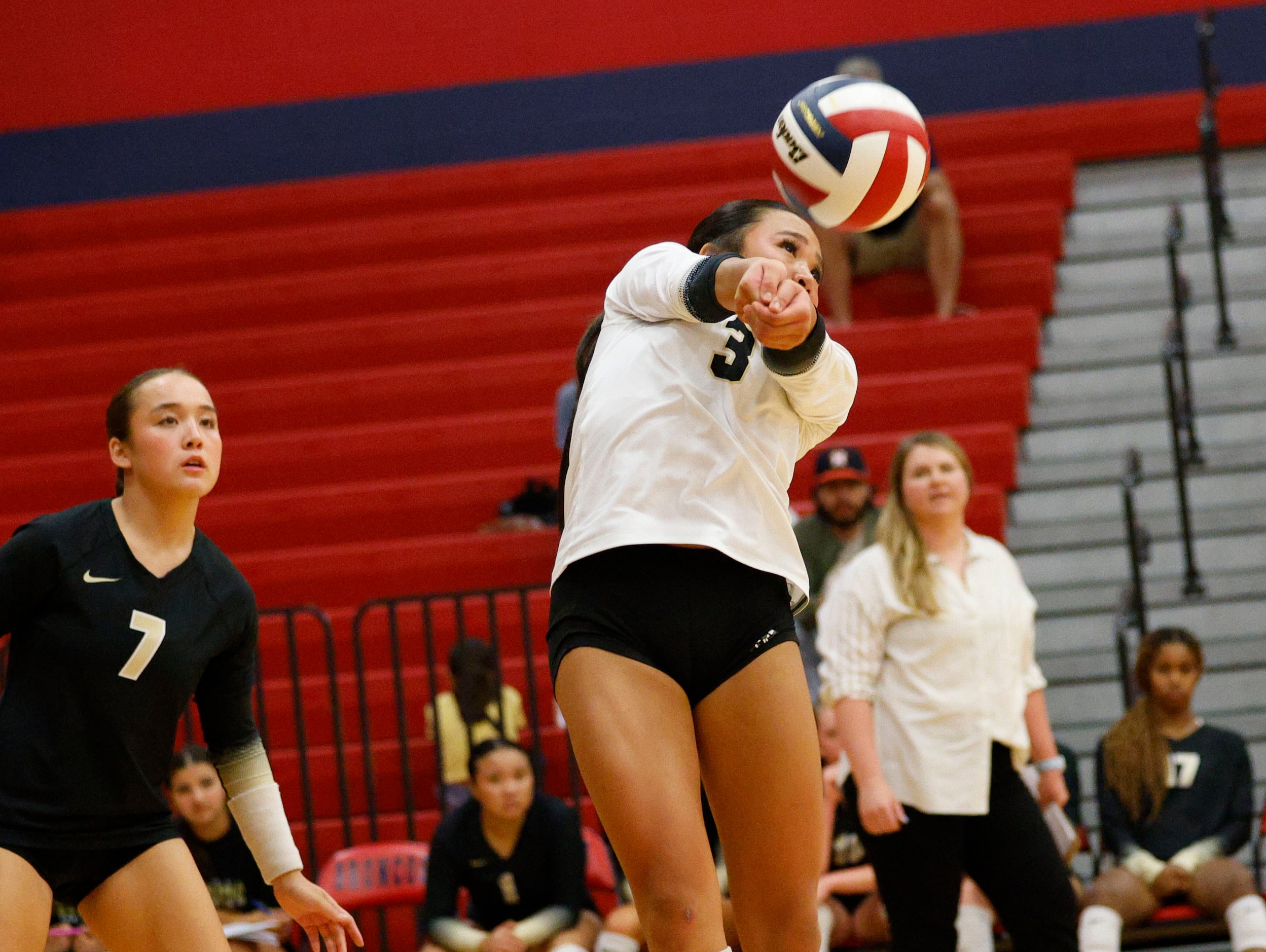 Plano East's Dakota Huynh (3) digs the ball against McKinney Boyd as Plano East's Lucy...