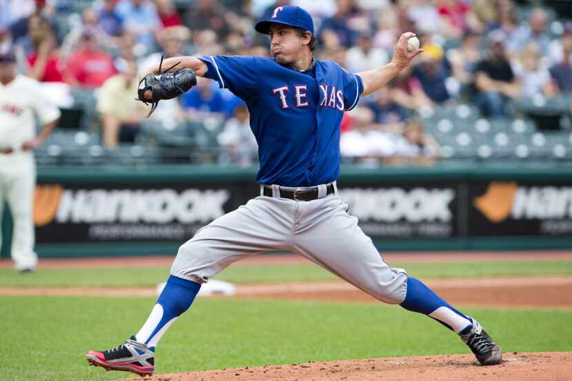 CLEVELAND, OH - SEPTEMBER 02: Starting pitcher Derek Holland #45 of the Texas Rangers...
