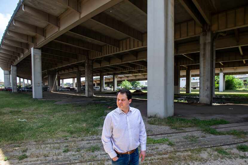 Jon Hetzel, president of the Deep Ellum Foundation, stands in the empty lots beneath I-345...