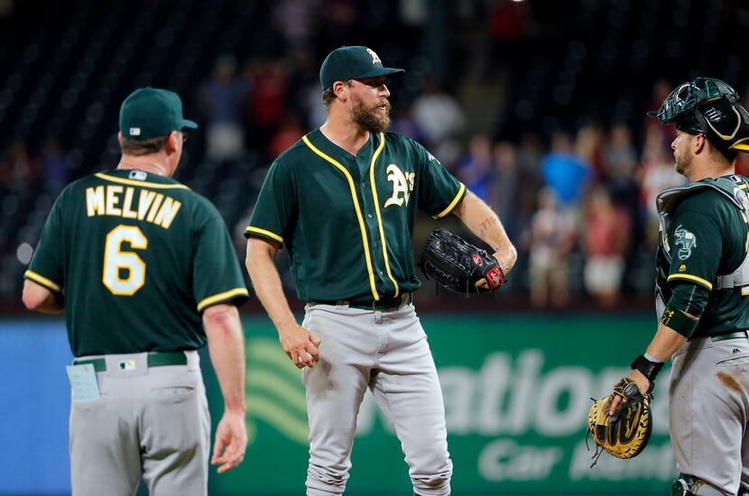 Oakland Athletics manager Bob Melvin (6) goes up to remove relief pitcher John Axford,...