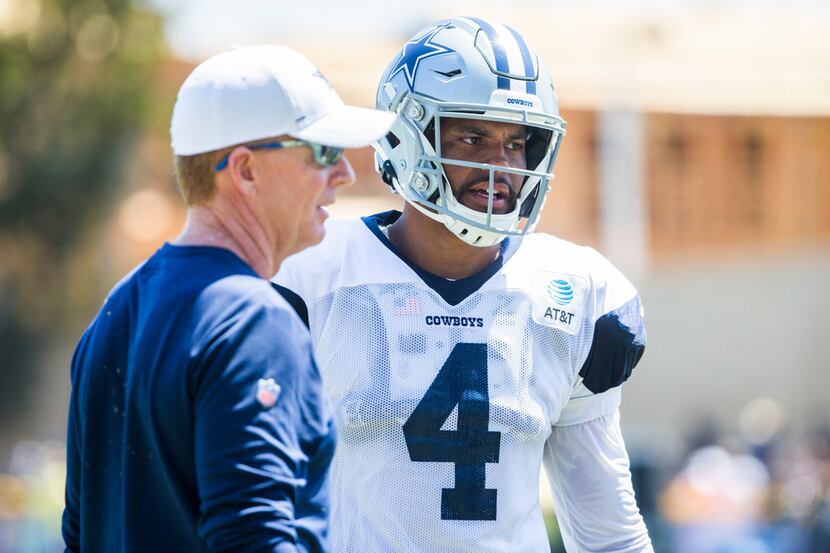Dallas Cowboys quarterback Dak Prescott (4) talks with head coach Jason Garrett during a...