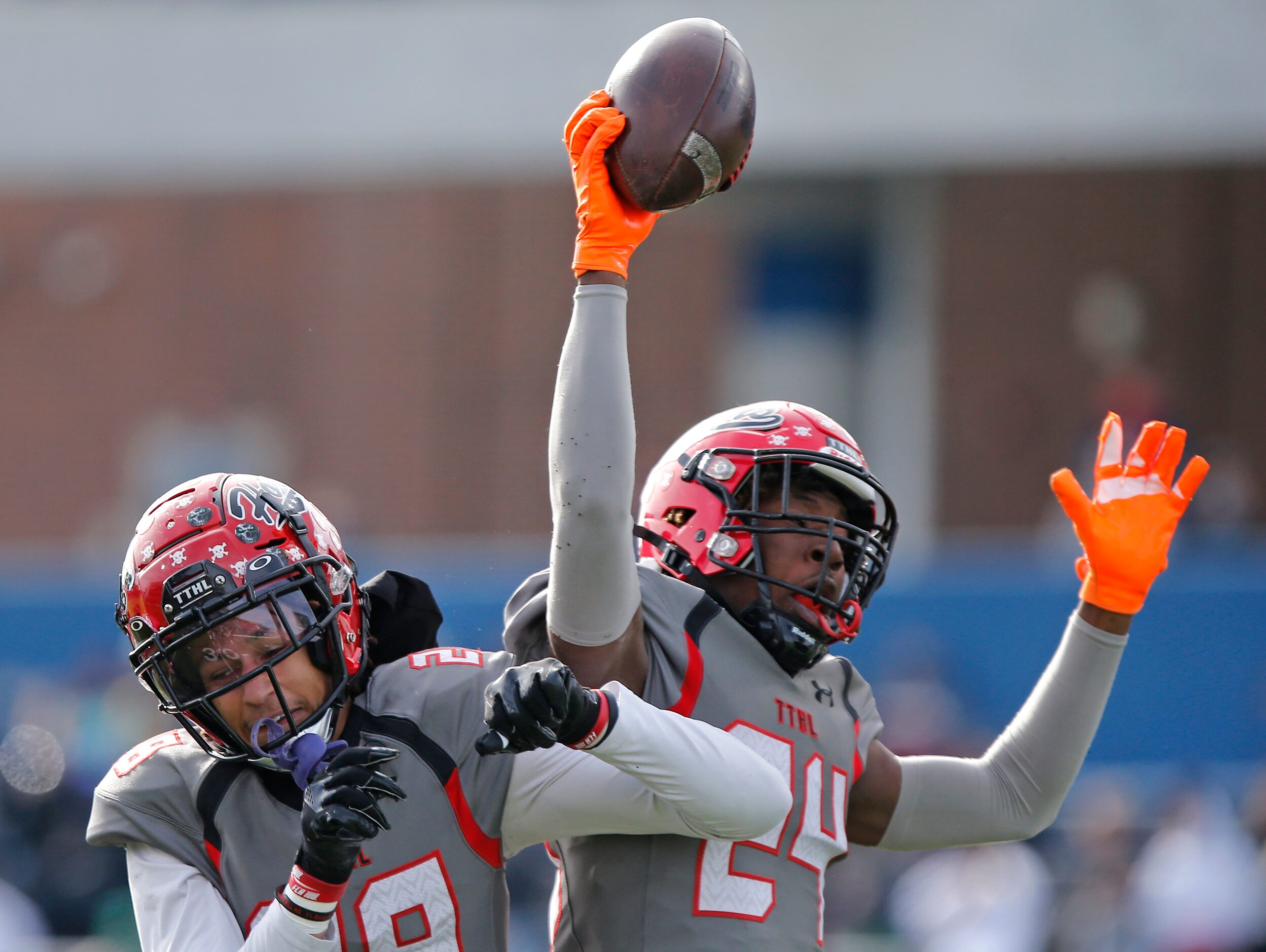 Cedar Hill High School cornerback Jalon Peoples (28) celebrates with Cedar Hill High School...