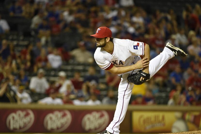 Texas Rangers relief pitcher Nick Martinez (22) pitches during their  MLB baseball game...