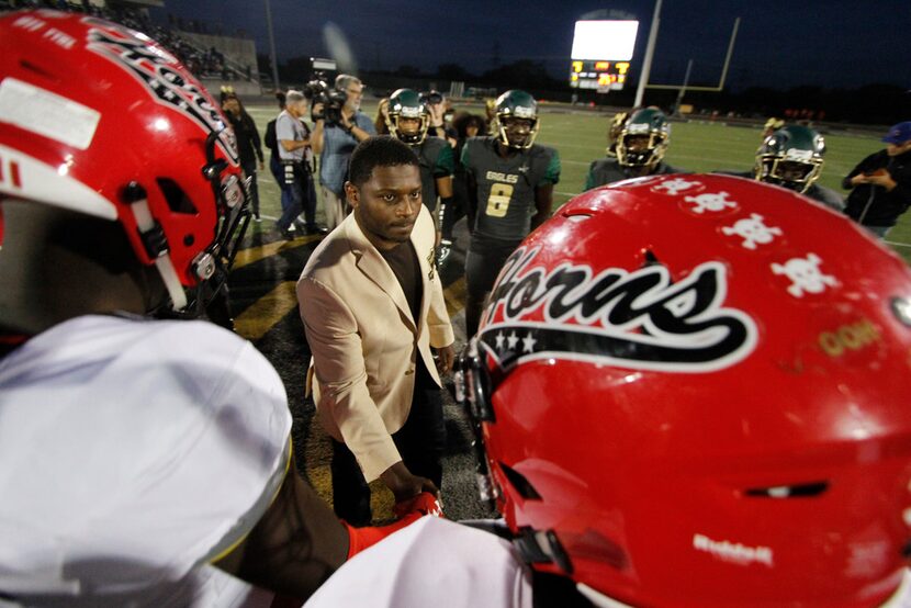 Pro Football Hall of Fame running back LaDainian Tomlinson greets the team captains at...