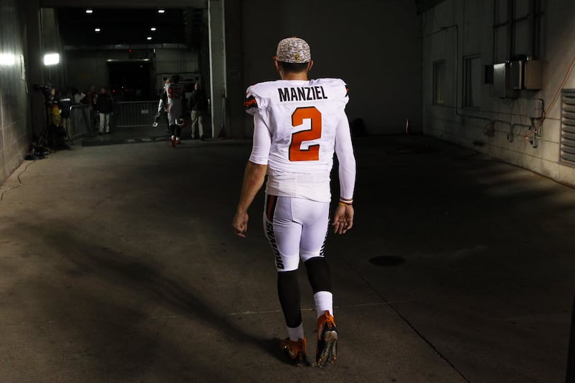 FILE - In this Nov. 5, 2015, file photo, Cleveland Browns quarterback Johnny Manziel walks...
