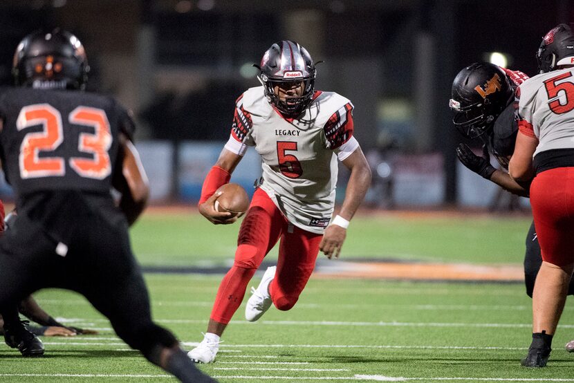 Mansfield Legacy junior quarterback Jalen Catalon (5) finds a hole on a touchdown run...