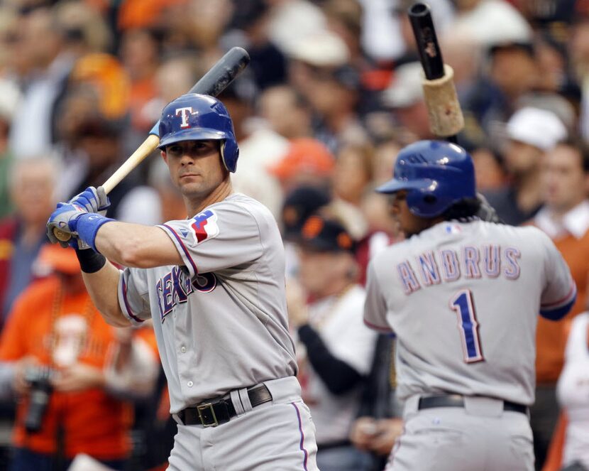 Texas Rangers Michael Young (10) and Elvis Andrus (1) warmup before the first pitch in a...