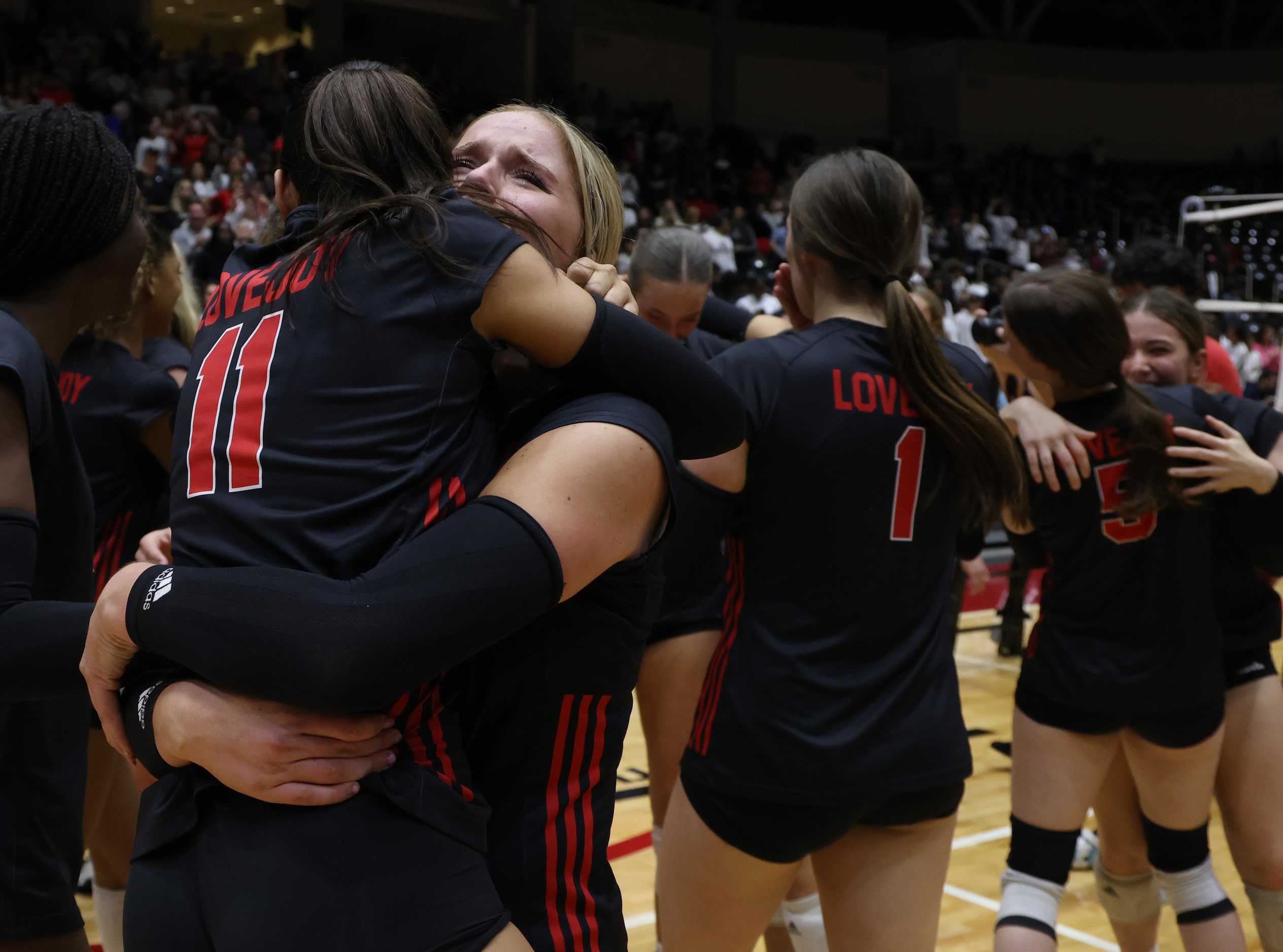 Lucas Lovejoy sophomore Skylar Jackson (10), left facing camera, sheds tears of joy while...