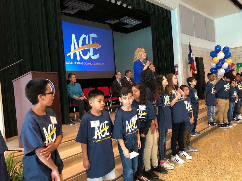 Richardson ISD superintendent Jeannie Stone, with a group of students from Carolyn G....