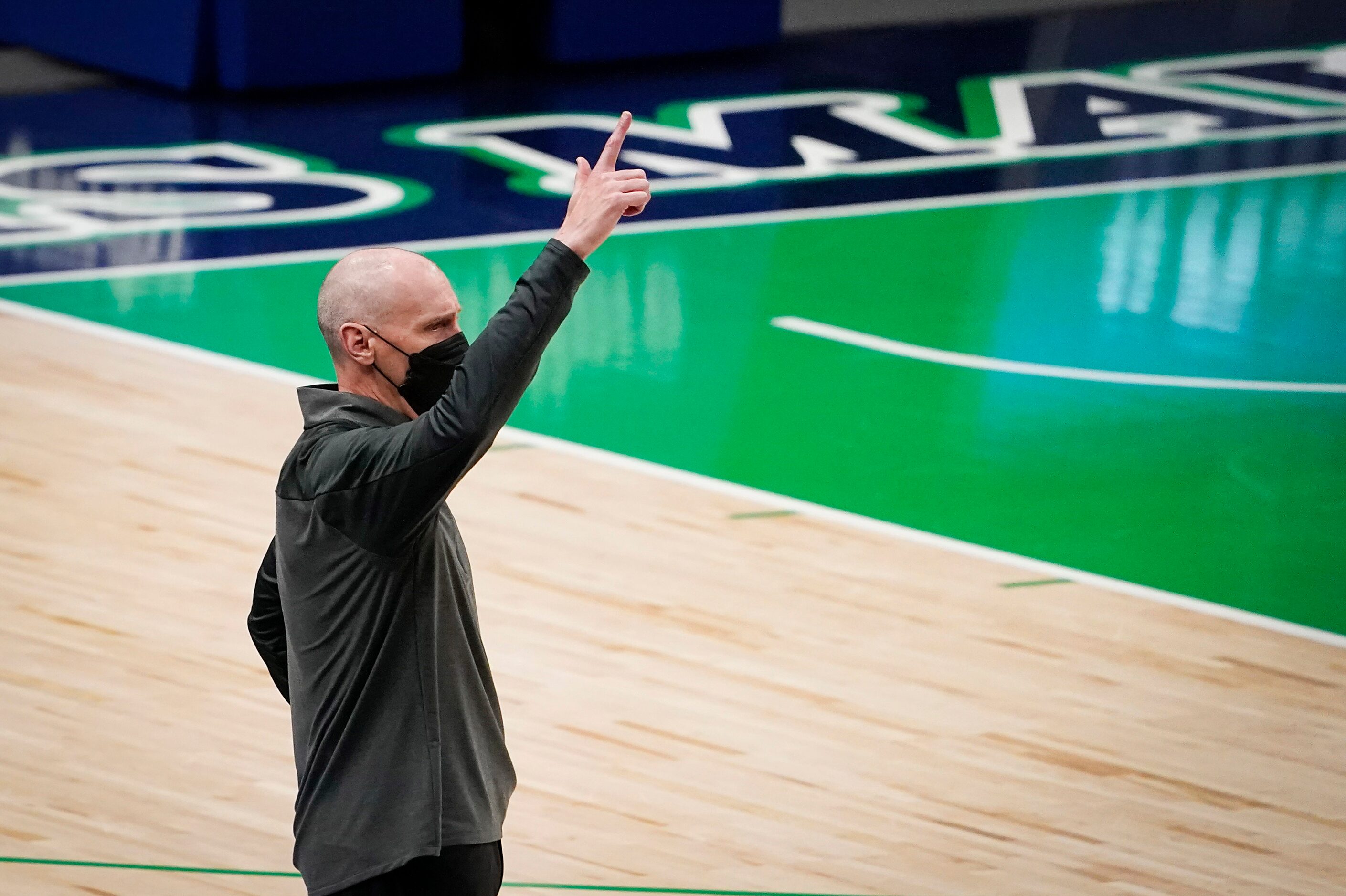 Dallas Mavericks head coach Rick Carlisle calls in a play during the first quarter of an NBA...