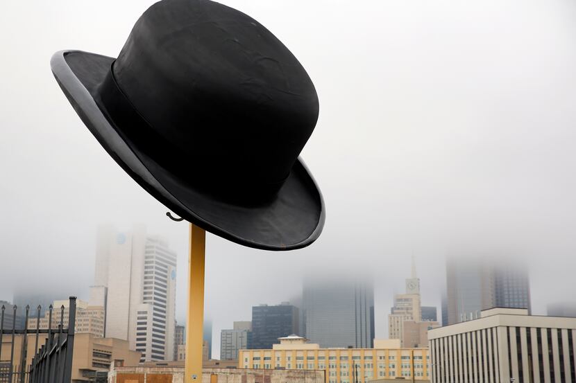 Downtown Dallas was shrouded by fog around a giant bowler hat sculpture by Keith Turman on...
