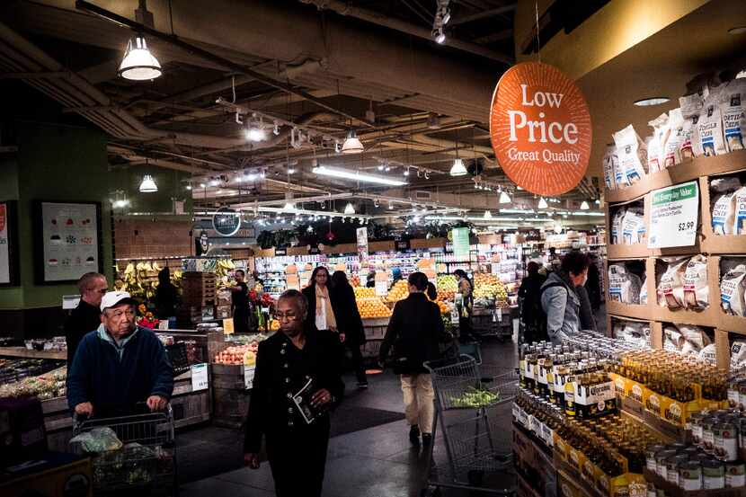 Customers at the Whole Foods Market in Columbus Circle in New York, April 19, 2017. A...