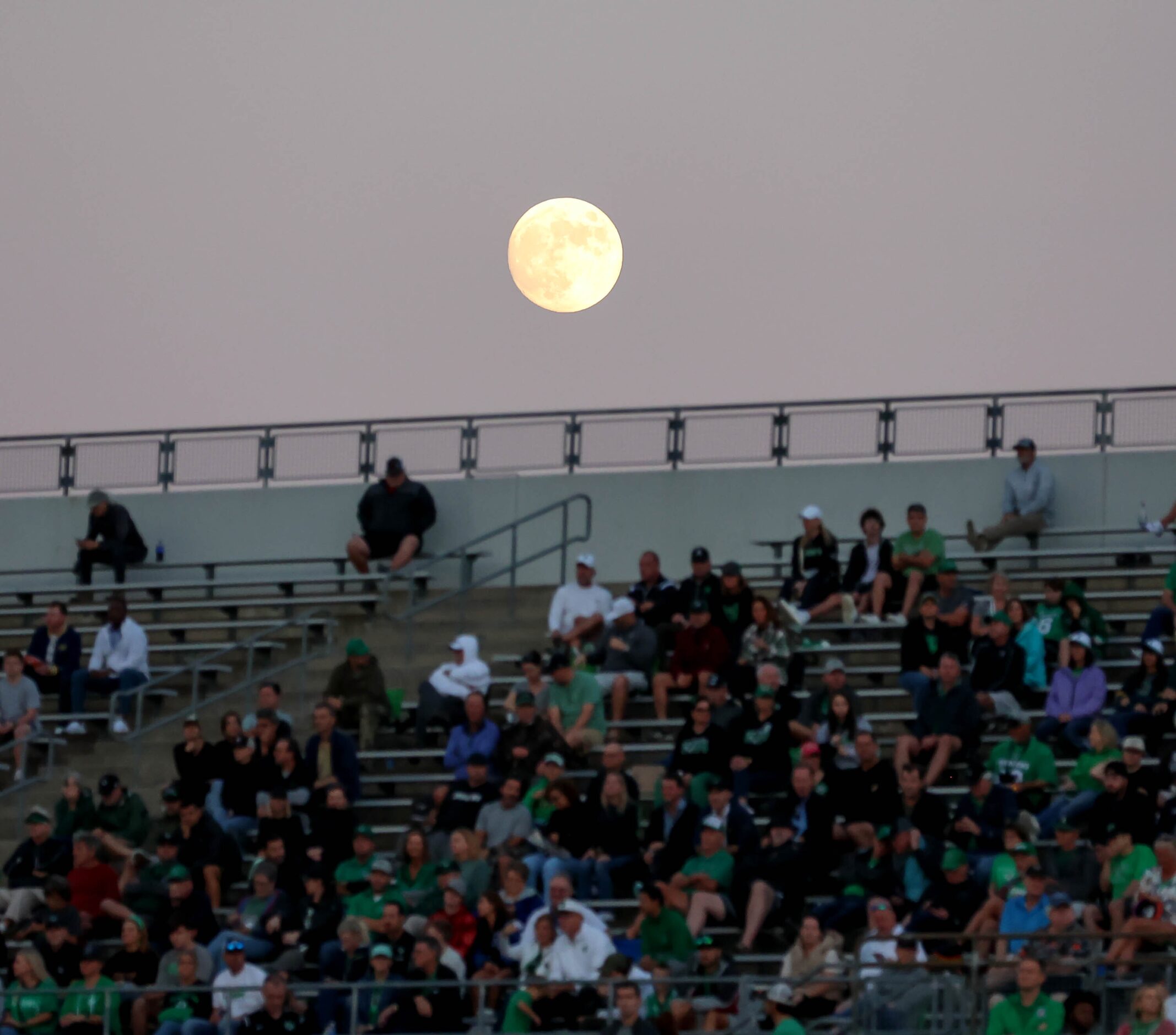 The moon lies over the stands during the game against Byron Nelson and Southlake Carroll in...