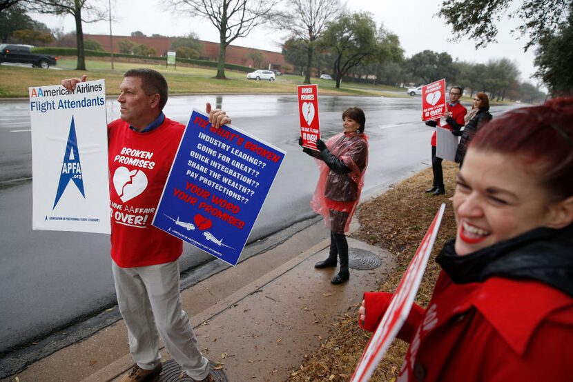 Matt Foust, base president of St. Louis, (left) and Toni Haste, graphic designer for the...