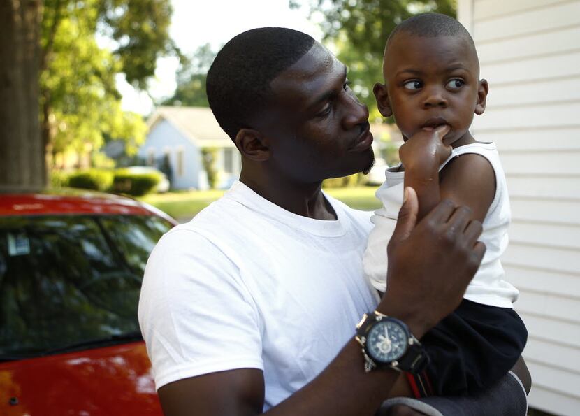 Cowboys first-round draft pick Morris Claiborne with his two-year-old son, Morris Claiborne,...
