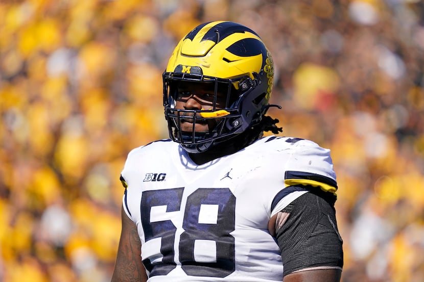 Michigan defensive lineman Mazi Smith stands on the field during the first half of an NCAA...