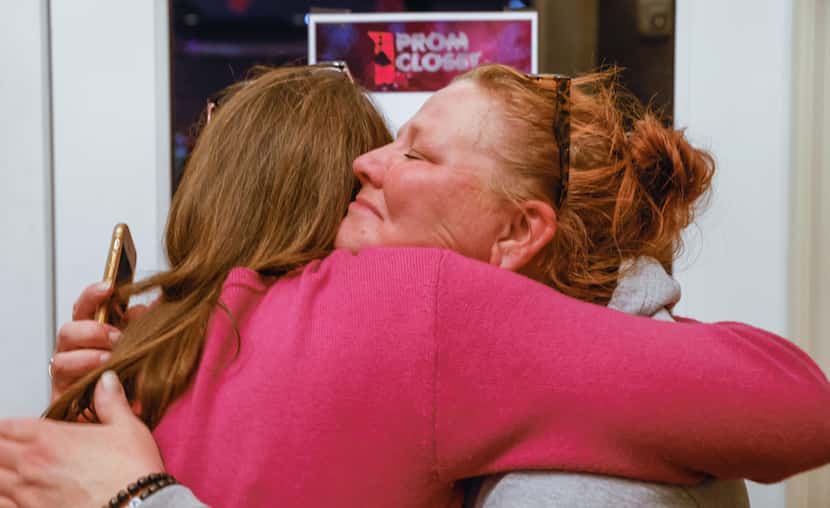 Kris Roberson (left) hugged Gayla Judge after seeing tears well up in Judge’s eyes at the...