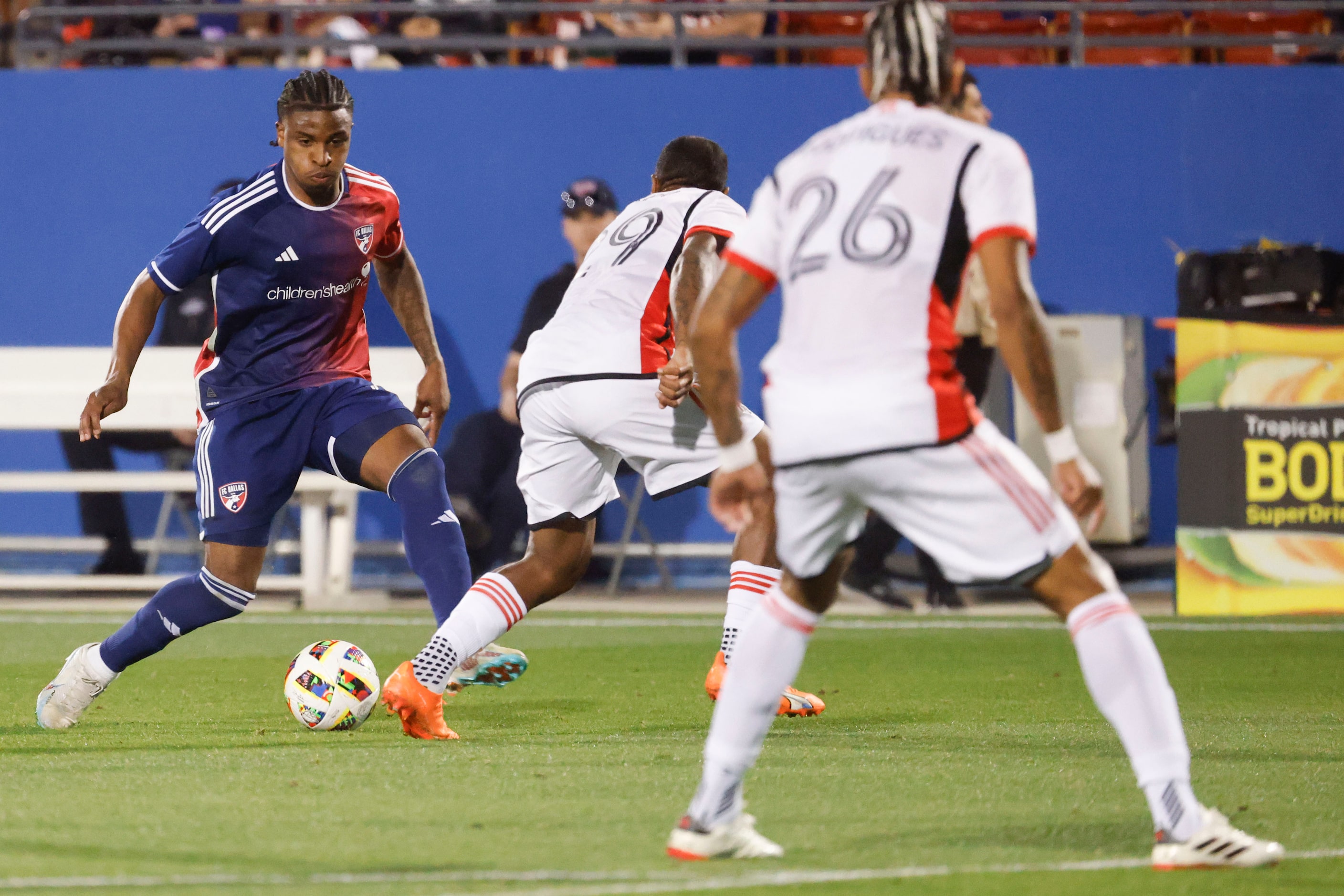 FC Dallas forward Dante Sealy attempt to dribble against San Jose defender Carlos Akapo...