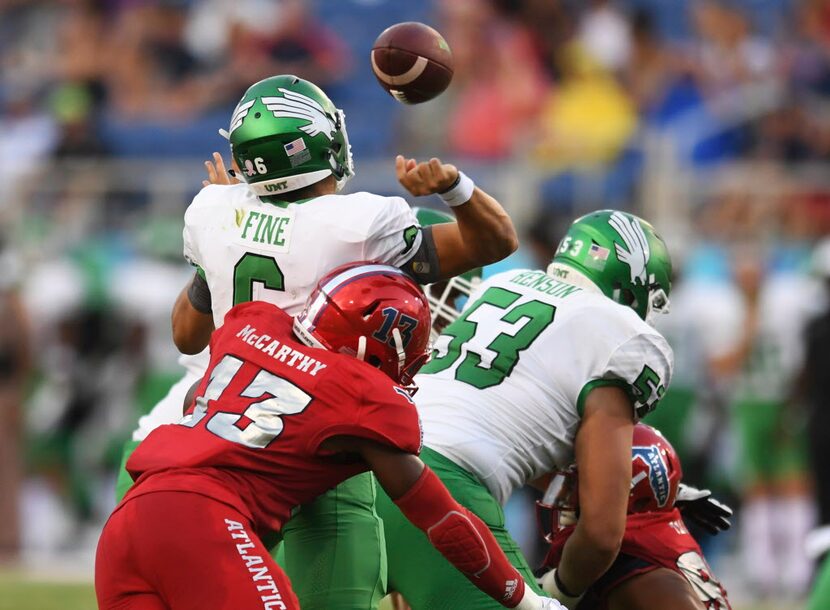 Florida Atlantic defensive end Leighton McCarthy (13) hits North Texas quarterback Mason...