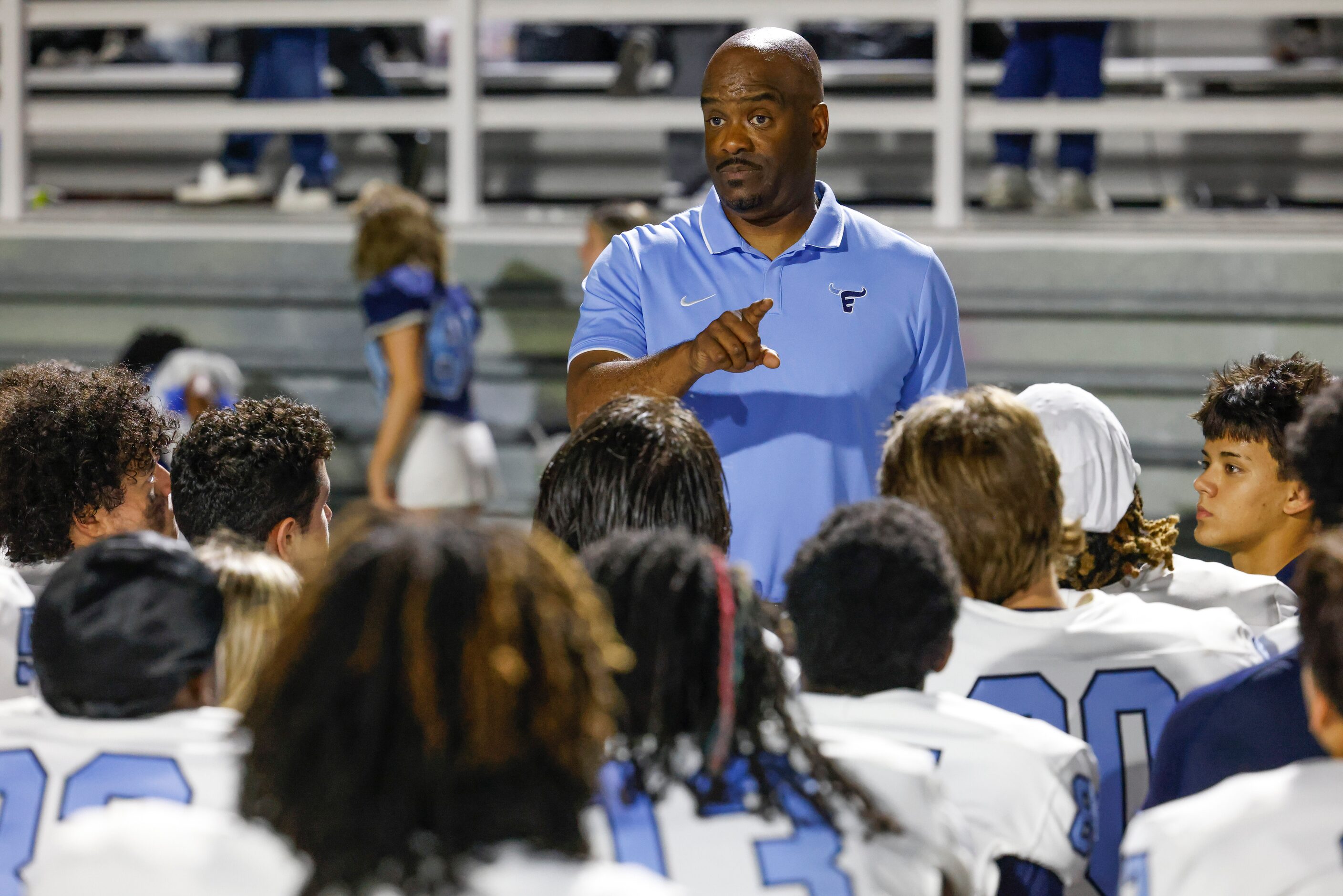 Emerson high’s football head coach Kendall Miller talks towards the players after winning...