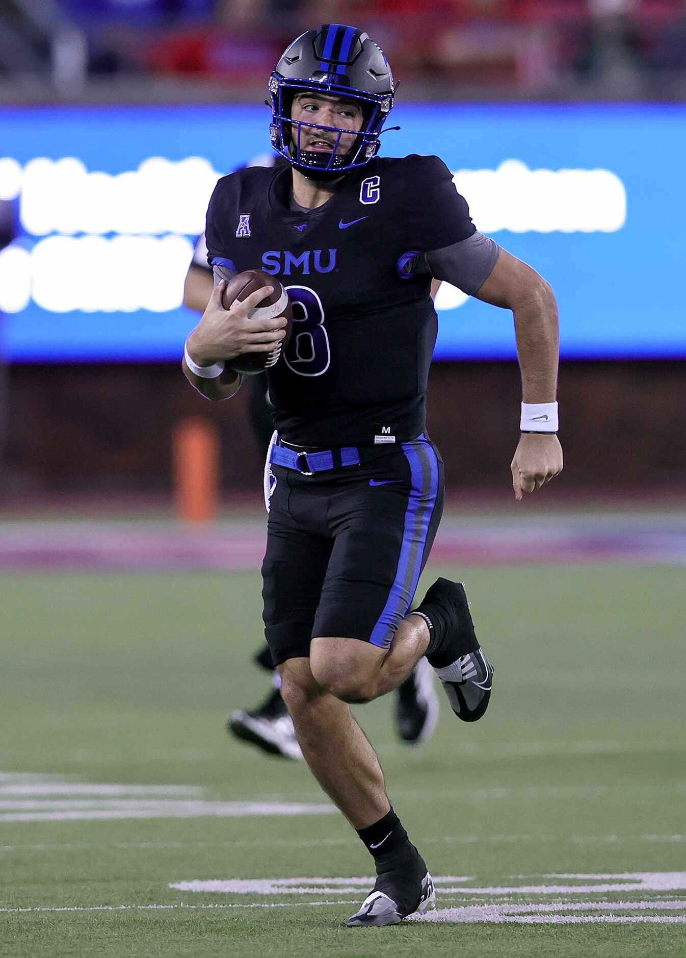 SMU quarterback Tanner Mordecai finds room to run against Houston during the first half of...