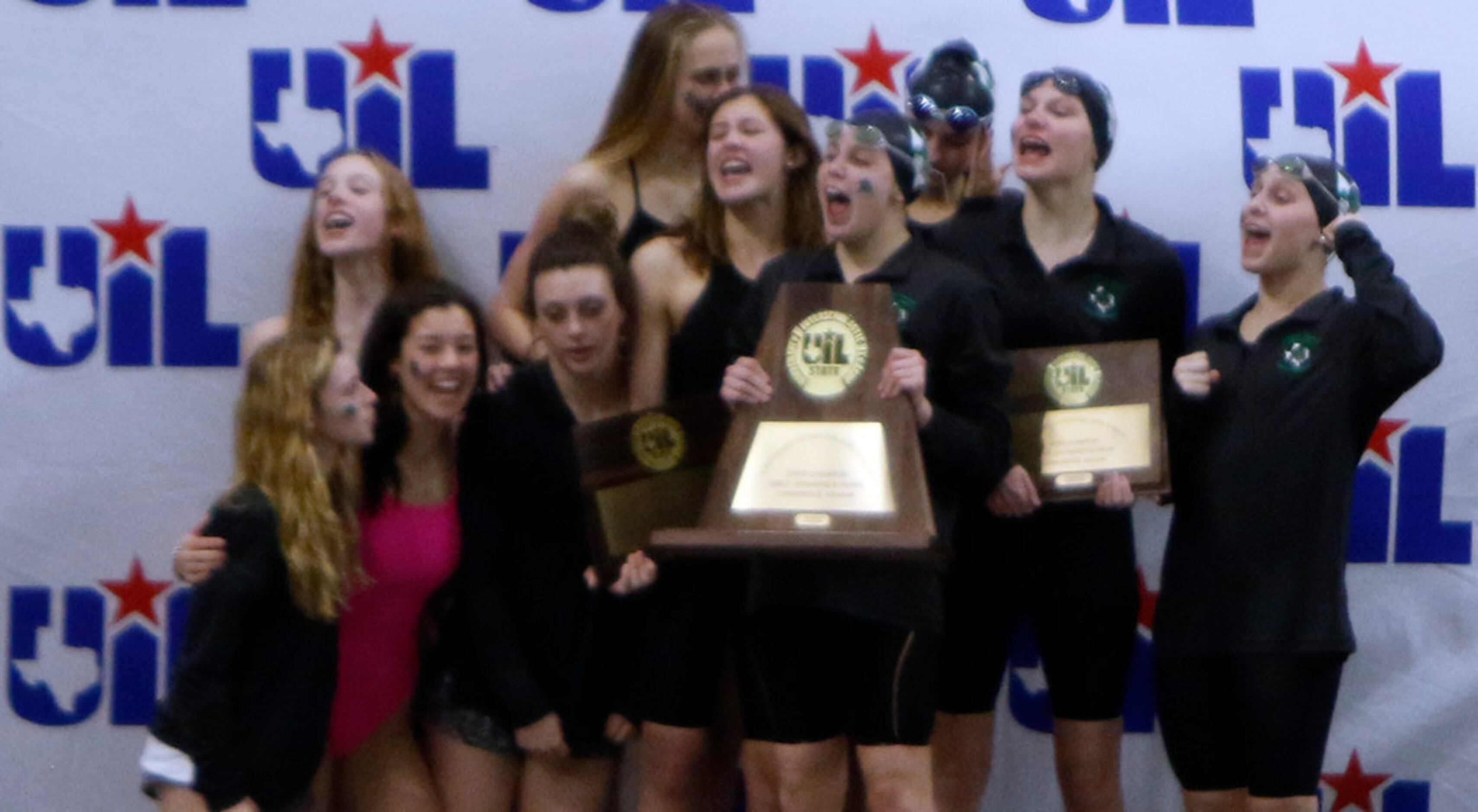 Members of the Southlake carroll girls swim team celebrate their first place victory win a...