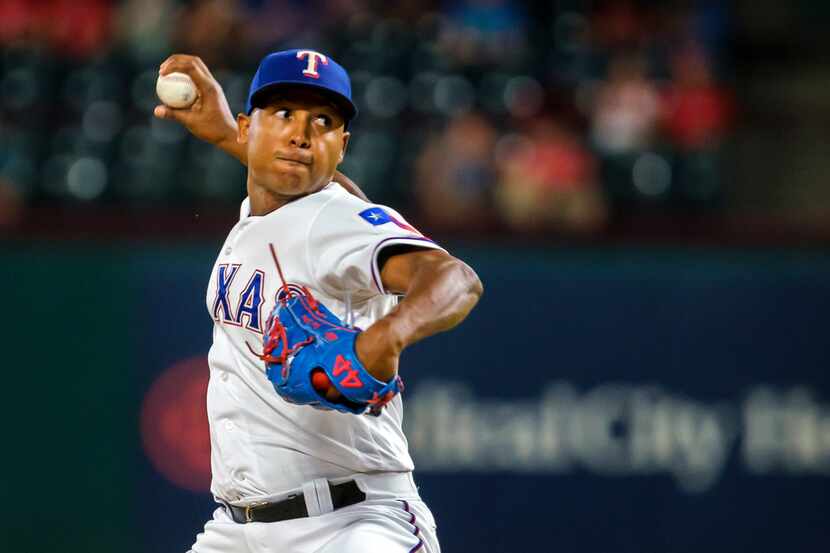 Texas Rangers relief pitcher Jose Leclerc pitches during the ninth inning against the Tampa...