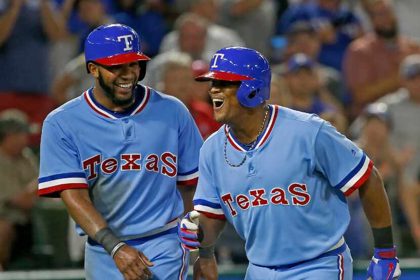 Texas Rangers third baseman Adrian Beltre (29) celebrates his two-run home run with Elvis...