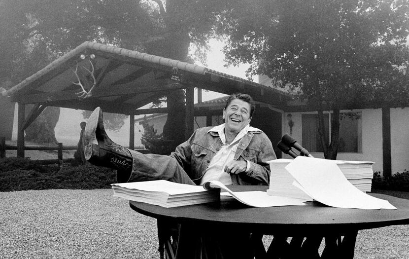 President Ronald Reagan signed tax cuts into law in 1981 at his California vacation home,...