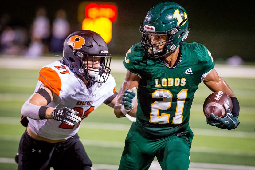 Longview's Kaden Kearbey looks for running room after a pass reception during Friday's...