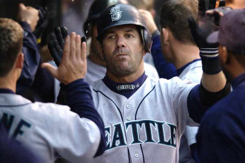 ORG XMIT: *S0405975104* Seattle Mariners Edgar Martinez is congratulated after hitting a...