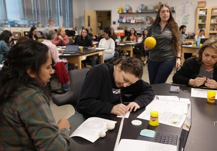 Anita Orozco, left, Katherine Roberts, and other North Texas teachers participate in a solar...