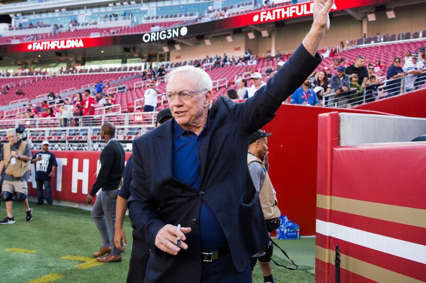 Dallas Cowboys owner Jerry Jones waves to fans before an NFL preseason game between the...