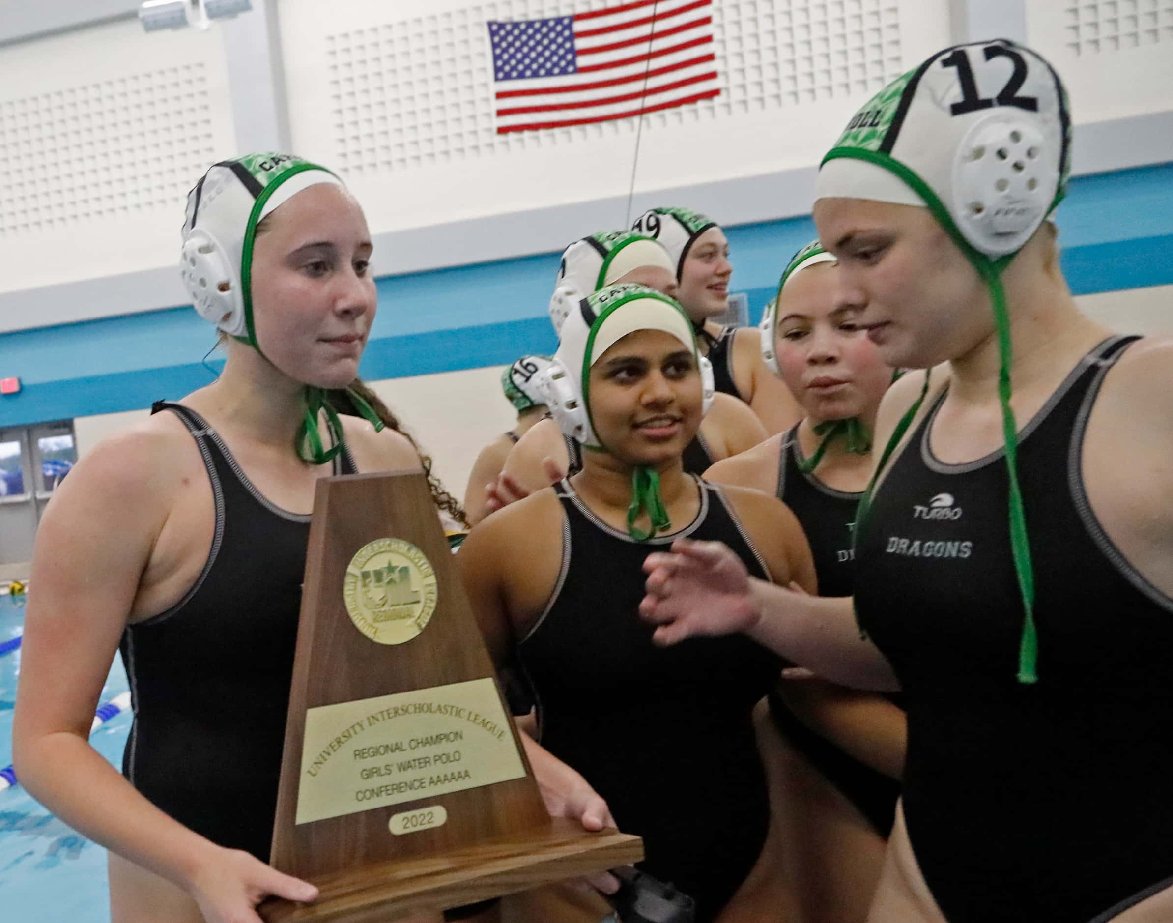 Southlake’s Sydney Rubin (7) hangs onto the Region Final trophy after winning the match as...