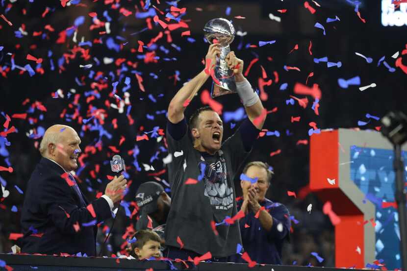 New England Patriots quarterback Tom Brady (12) and New England Patriots head coach Bill...
