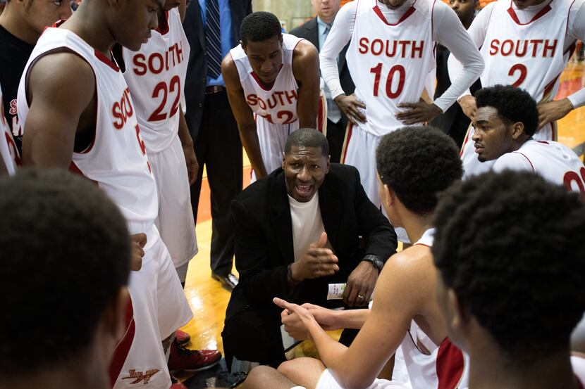 South Grand Prairie coach Brandon Bennett instructs his team during a timeout in the Class...