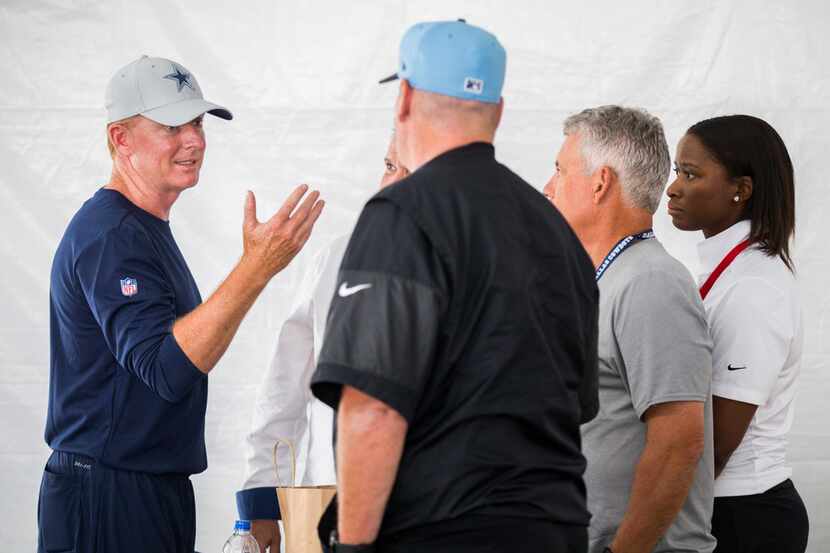 Dallas Cowboys head coach Jason Garrett talks with NFL Officials before an afternoon...
