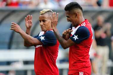 FC Dallas midfielder Michael Barrios (21) dances with FC Dallas forward Jesus Ferreira (27)...