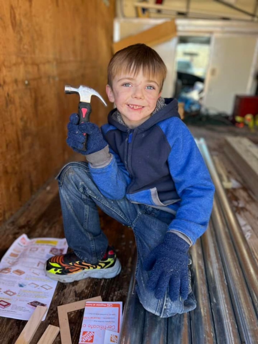 About 40 community members gathered Saturday to build a fence outside Conners Landers' home...