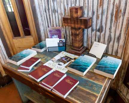 Copies of the Bible and the New Testament sit on a table in the entrance at Baker's Ribs in...