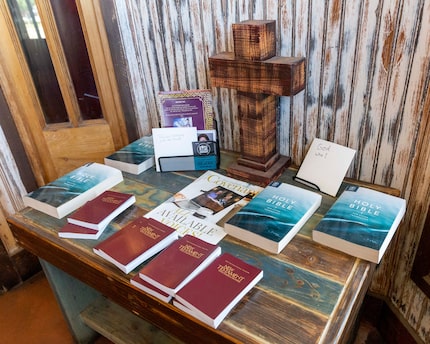 Copies of the Bible and the New Testament sit on a table in the entrance at Baker's Ribs in...