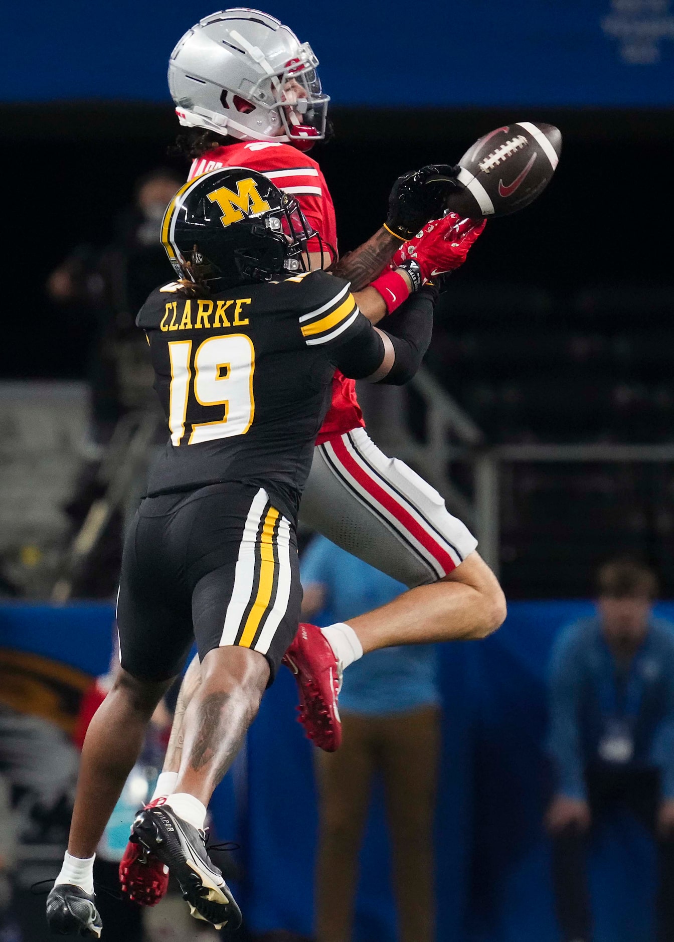 Missouri defensive back Marcus Clarke (19) breaks up a pass intended for Ohio State wide...