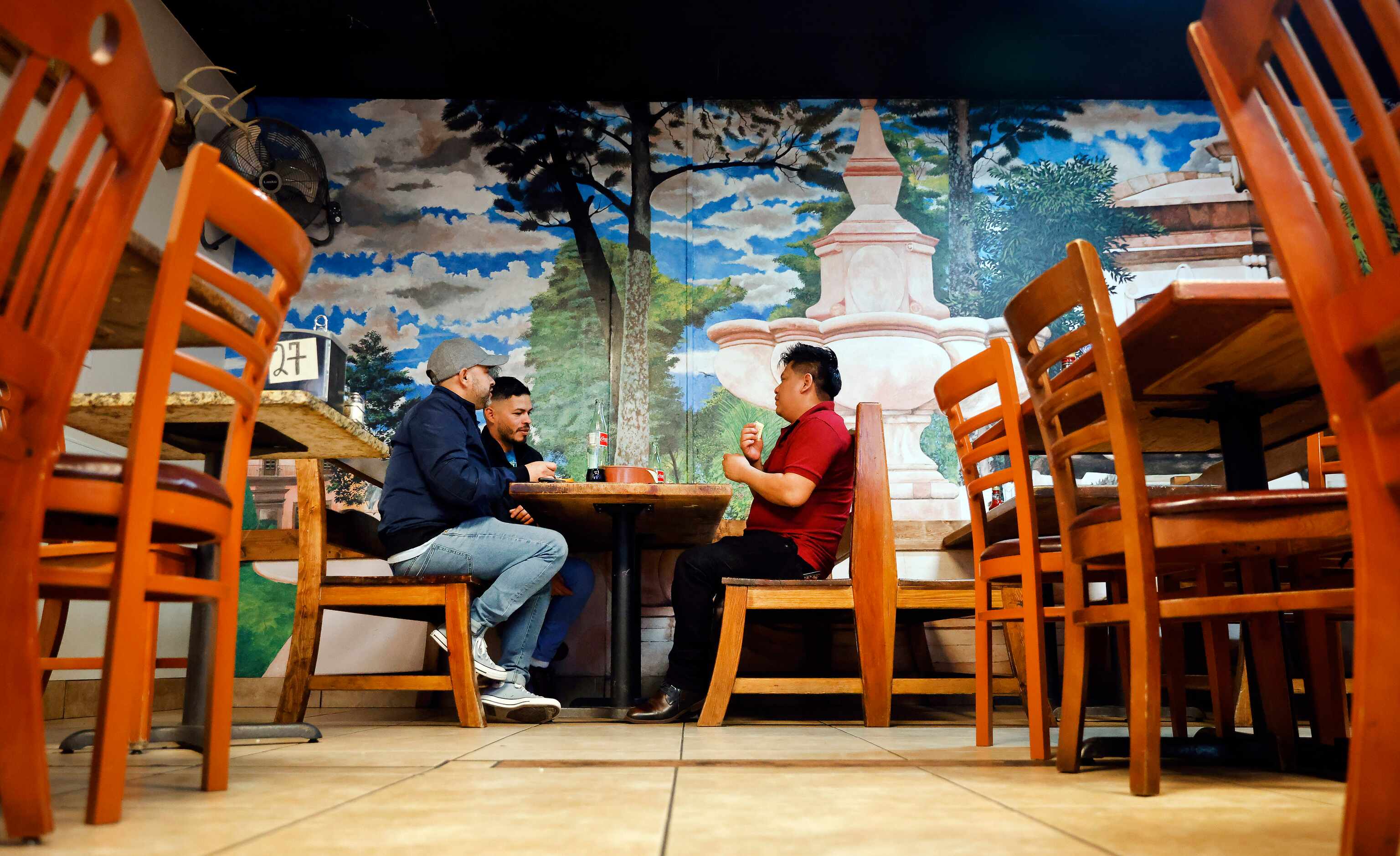 Fort Worth friends (from left) Jose Munoz, Salvador Centeno and Reginaldo Ayala eat lunch...