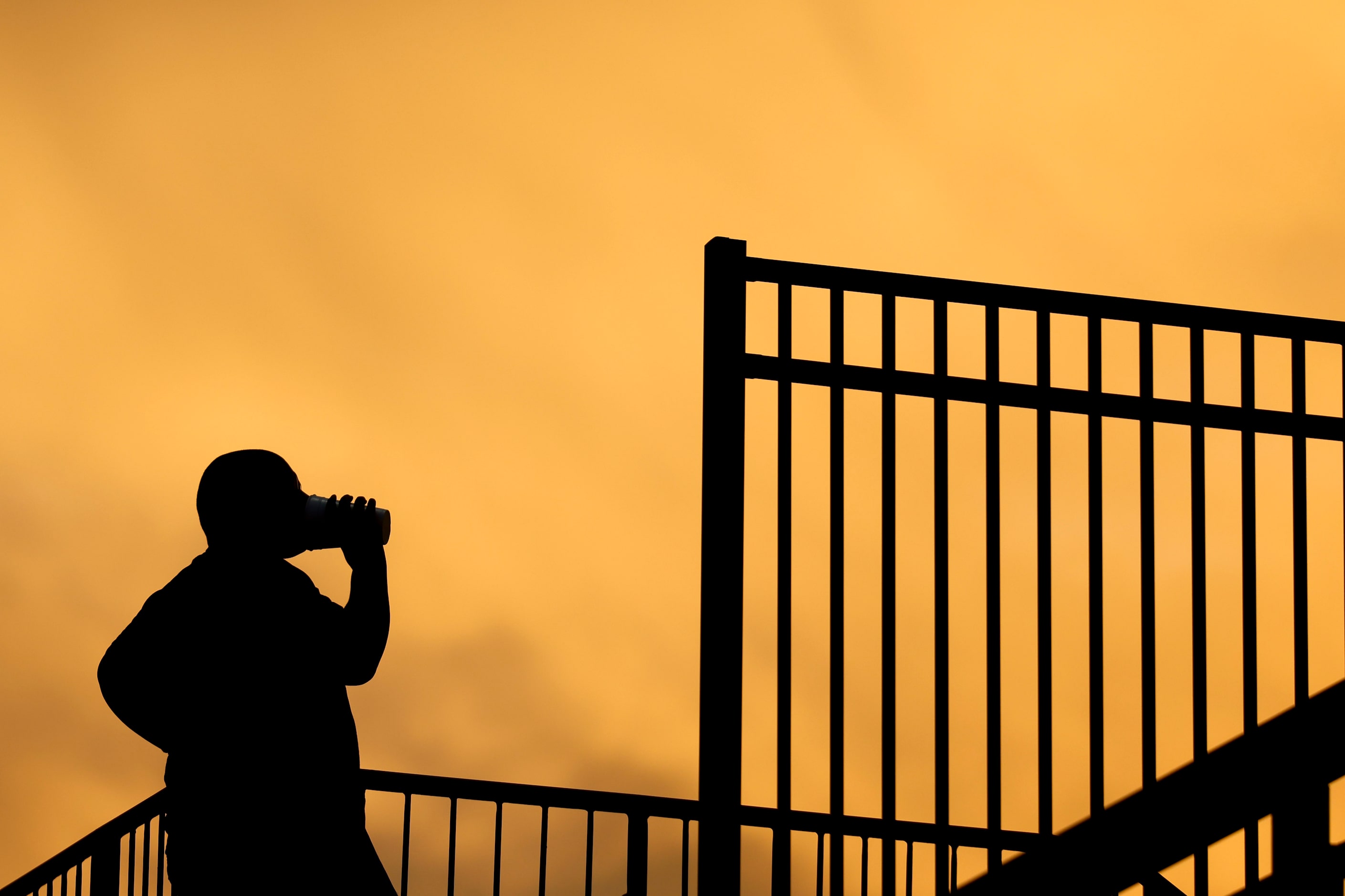 A person takes a drink ahead of a football game between Kimball and Carter High on Saturday,...