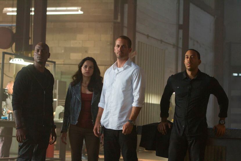 This photo provided by Universal Pictures shows, from left, Tyrese Gibson as Roman, Michelle...