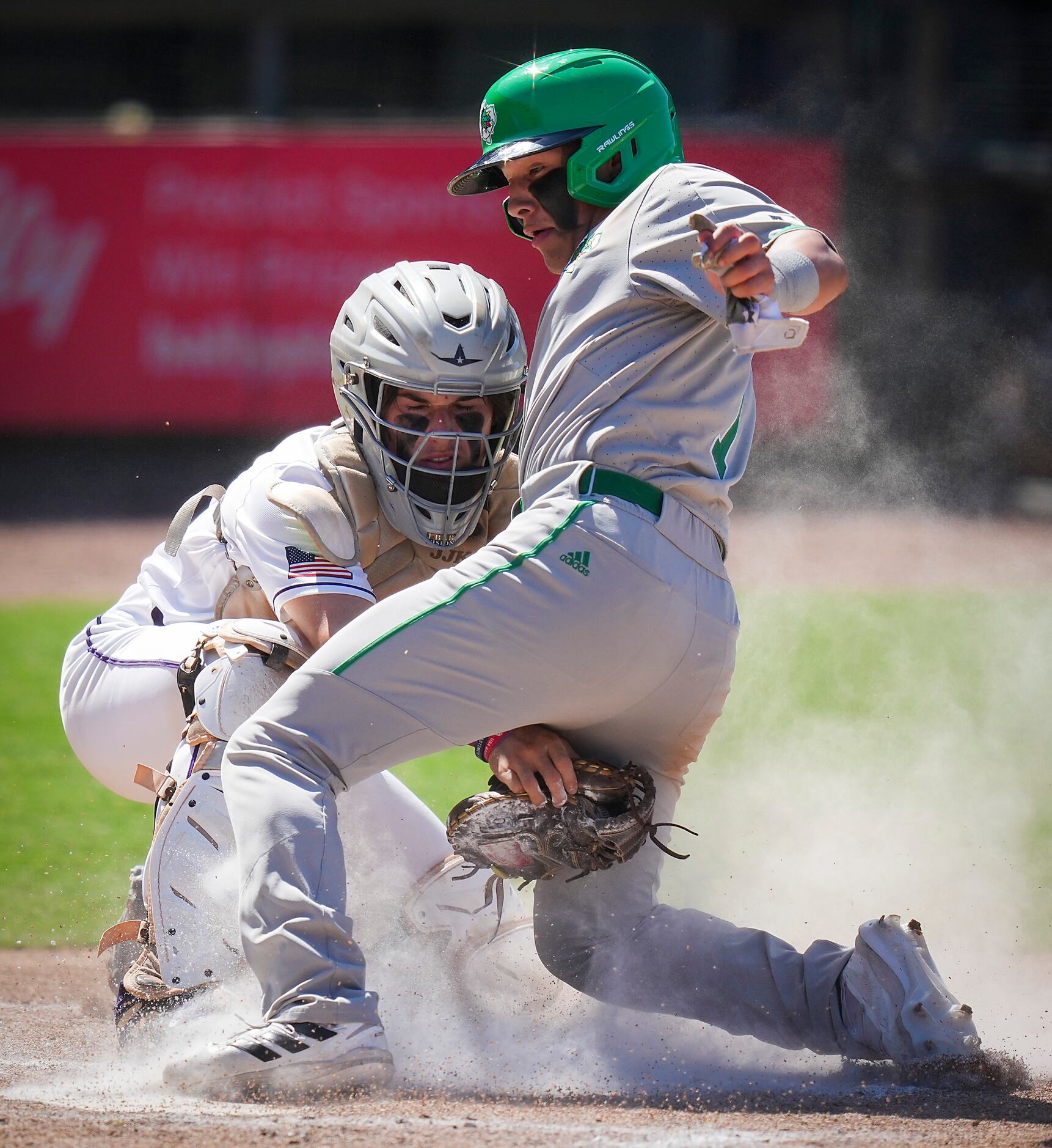 Southlake Carroll shortstop Ethan Mendoza is out at home as Fort Bend Ridge Point catcher JJ...