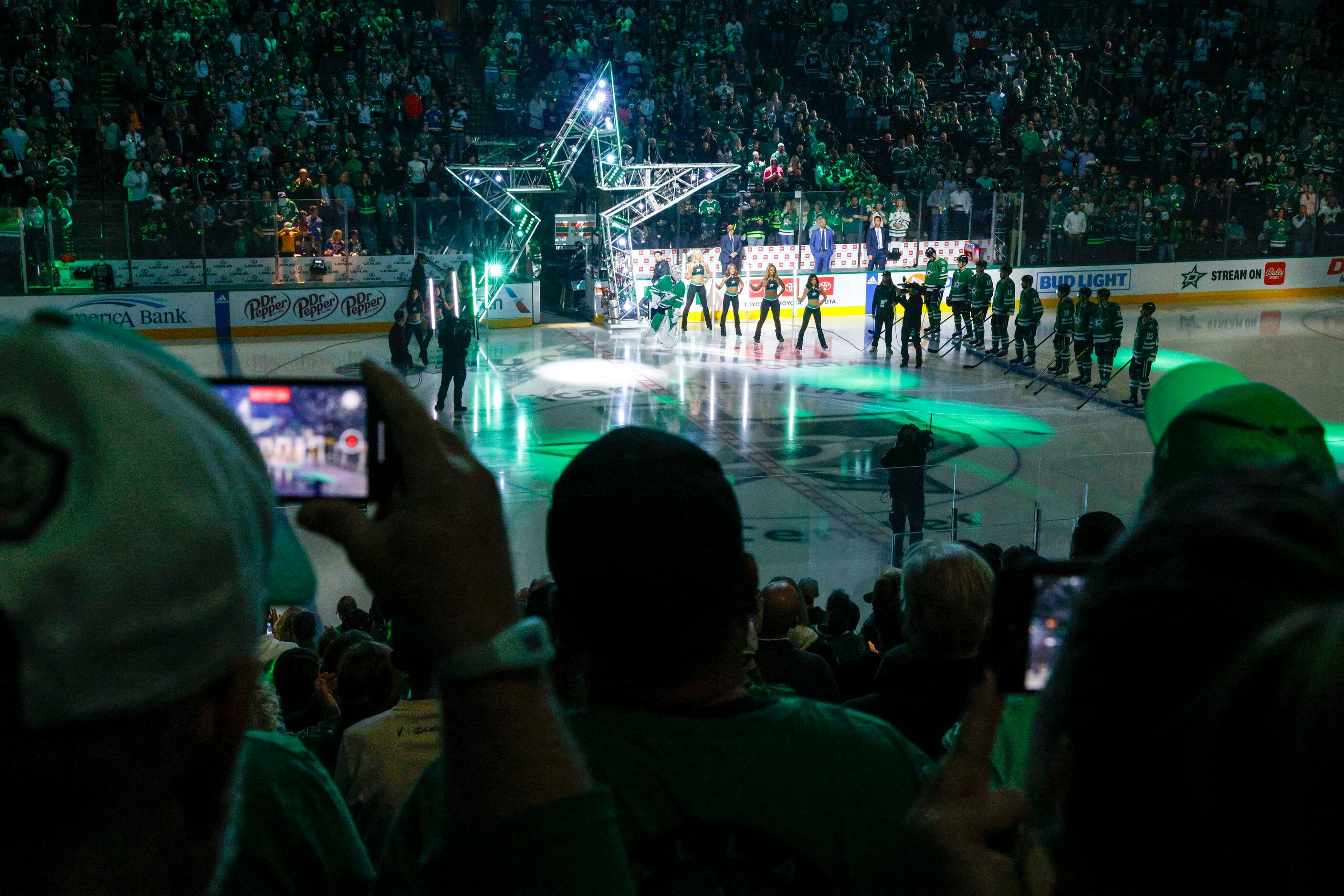 Dallas Stars fans cheer as goaltender Jake Oettinger (29) takes the ice during player...